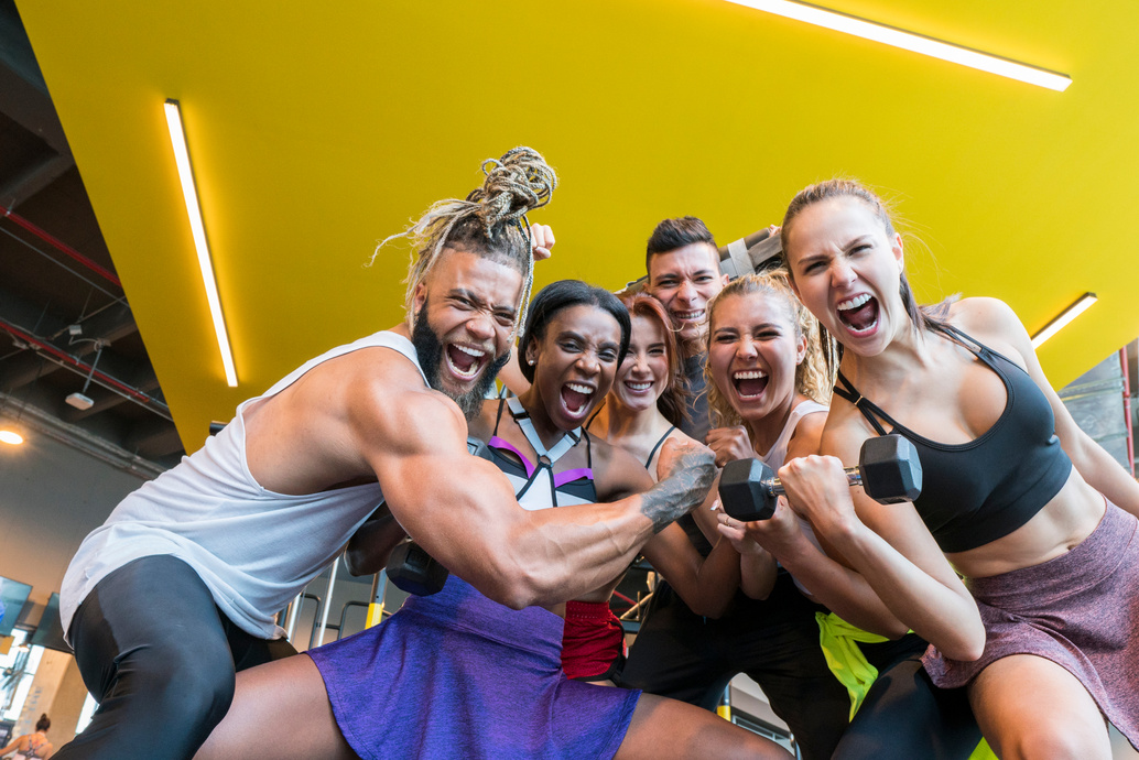 Group of friends training in the gym